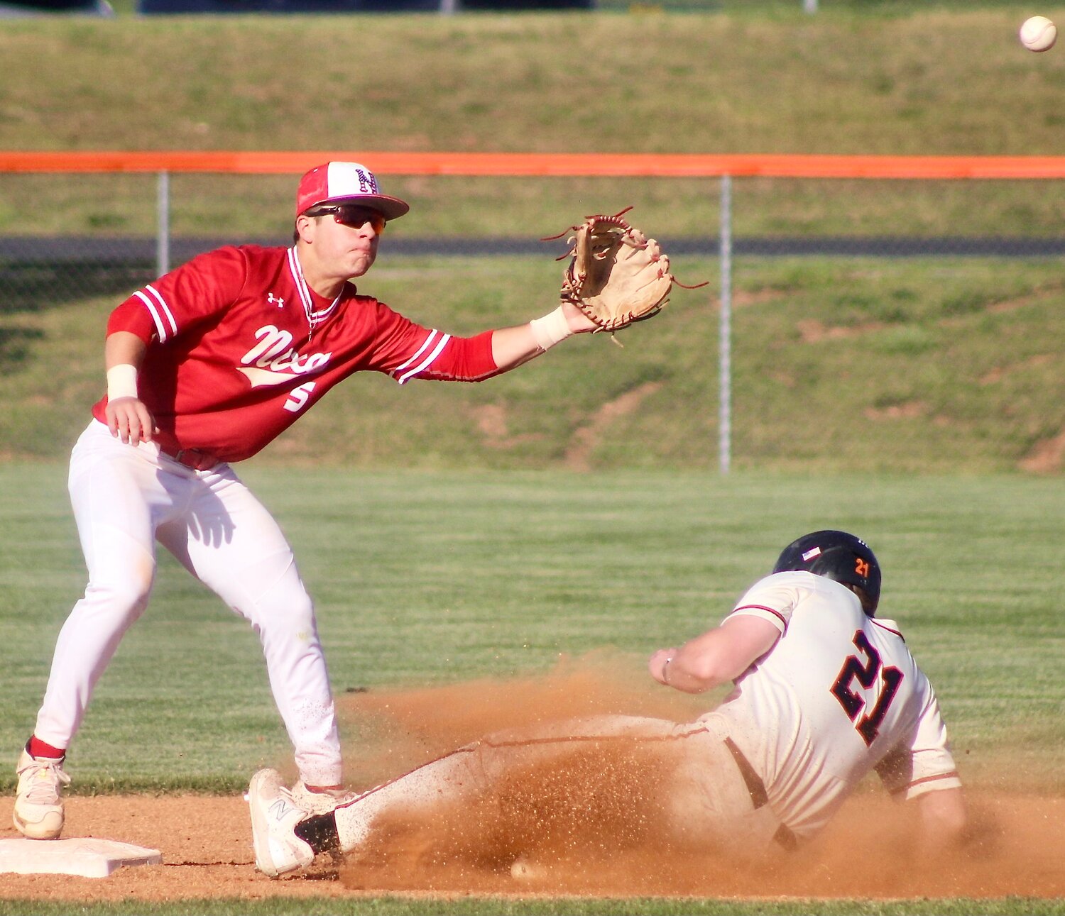 NIXA'S COLLIN USSERY catches a late throw at second base.