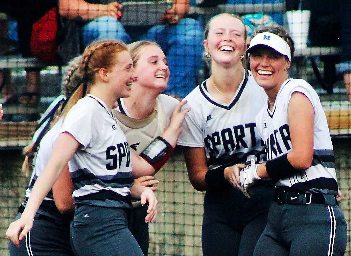 MYA FUOTON, MADELINE BROWN, NATLIE WILKS AND MEGAN BROWN are all smiles after Sparta's win.