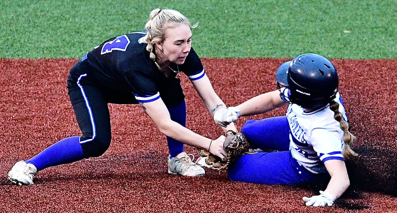 CLEVER'S CHLOE STIDHAM tags out a baserunner.