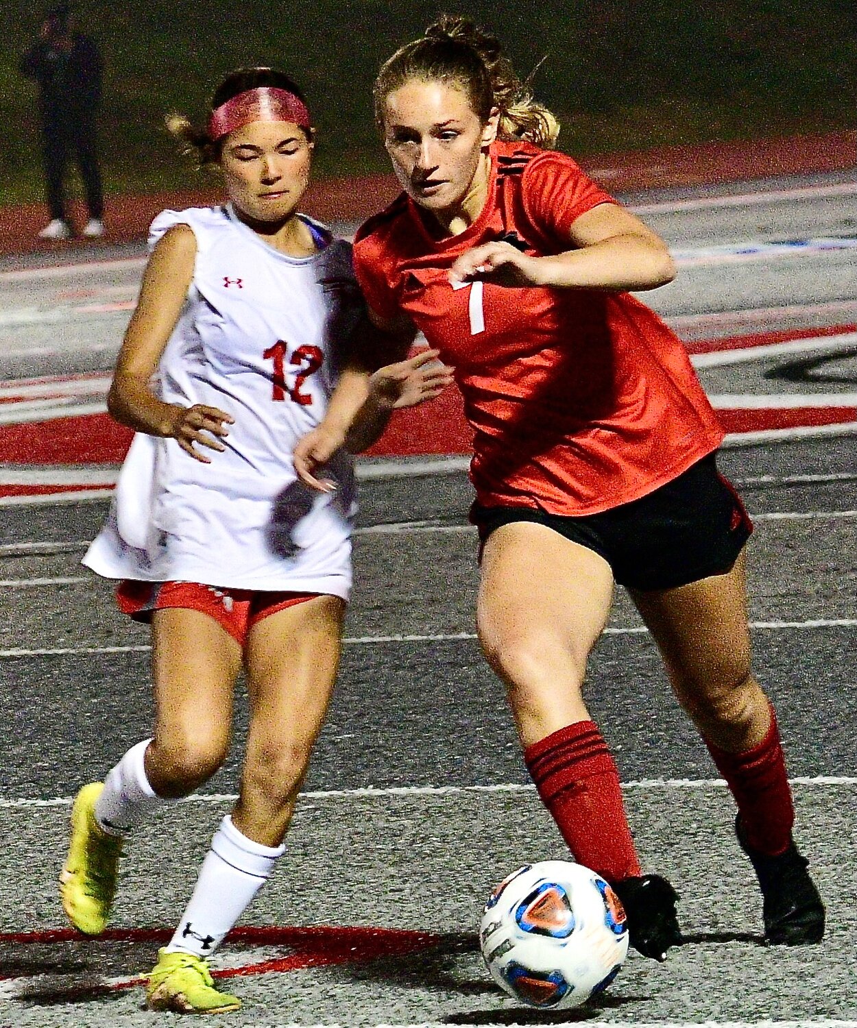 NIXA'S LILLY KIRK tries to complete a steal of the ball.