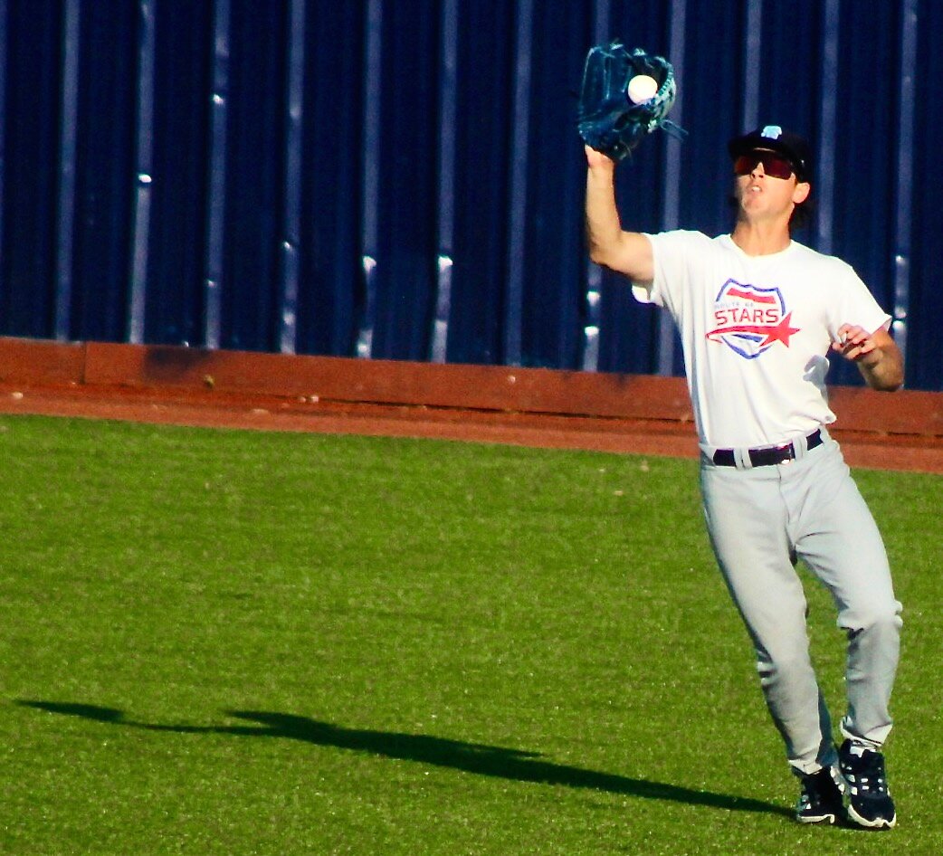 NIXA GRAD SAM RUSSO camps under a fly ball in center field during Show-Me Collegiate League action.