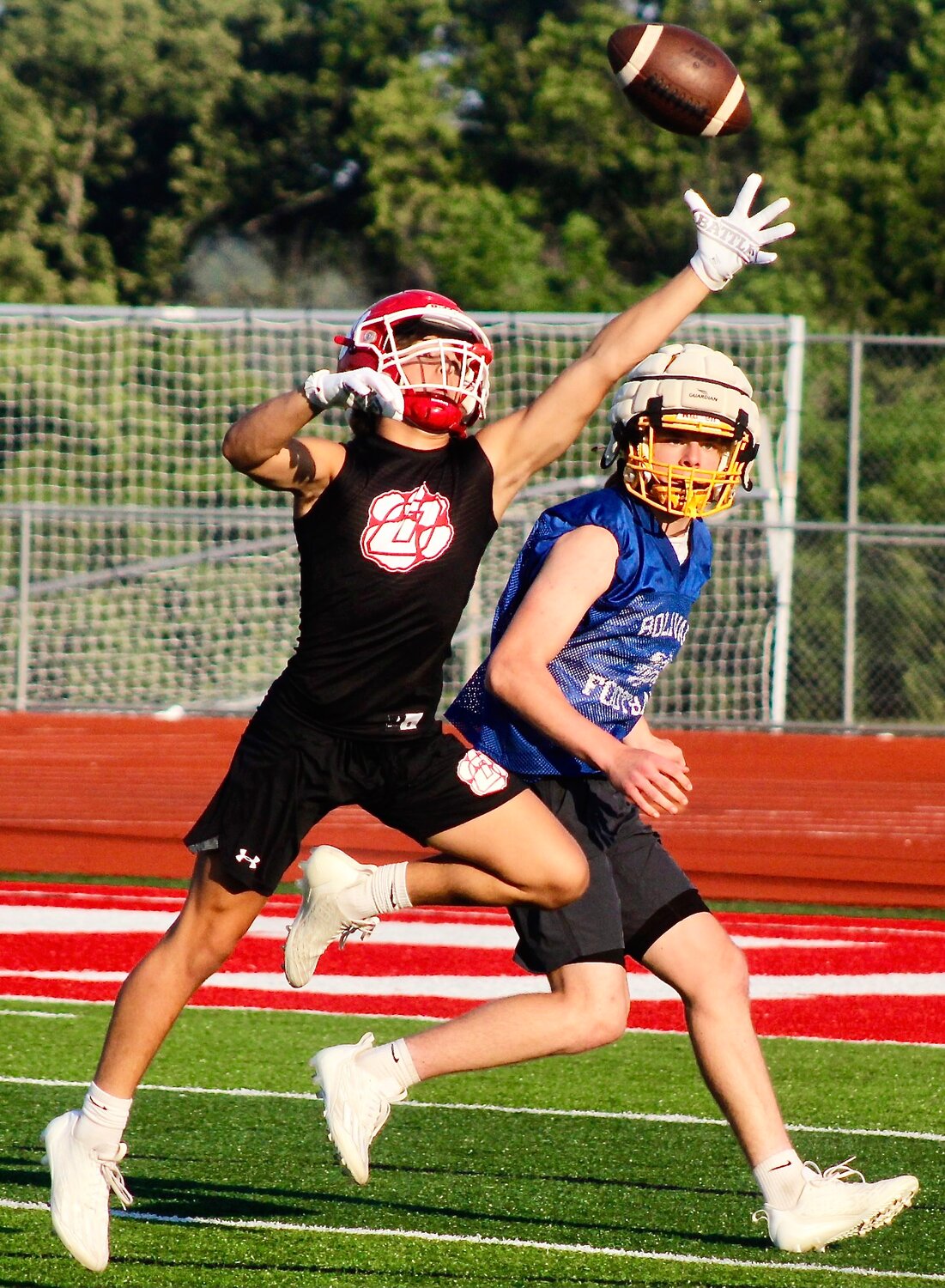 OZARK'S ANTHONY CORDELL reaches for a reception during 7-on-7 action.