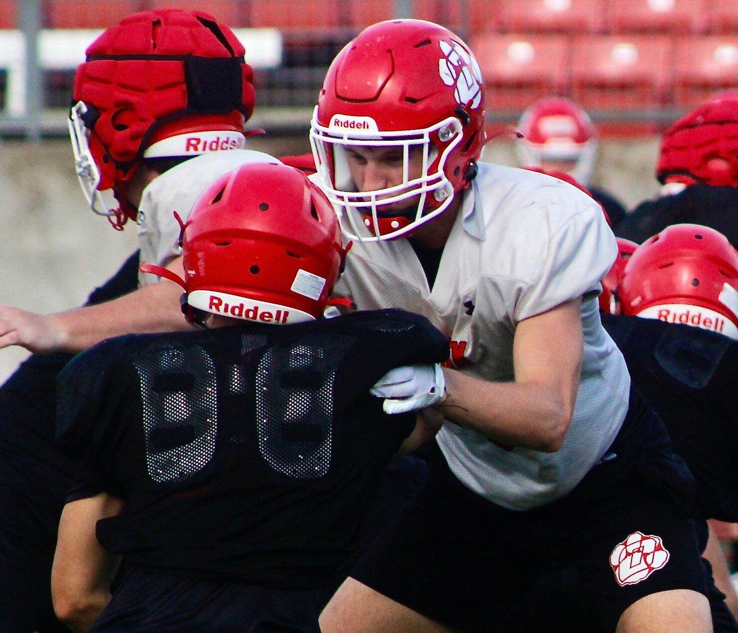 OZARK'S JACE WHATLEY blocks along the Tigers' offensive line during a workout this week.