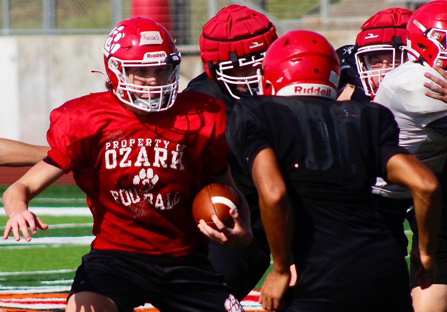 OZARK'S PEYTON RUSSELL carries the ball out of the Tigers' offensive backfield.