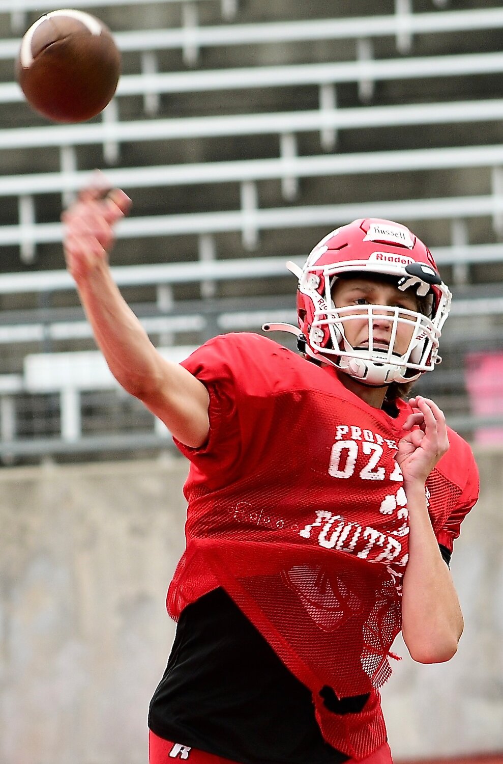 OZARK'S PEYTON RUSSELL fires a pass during the Tigers' summer camp.