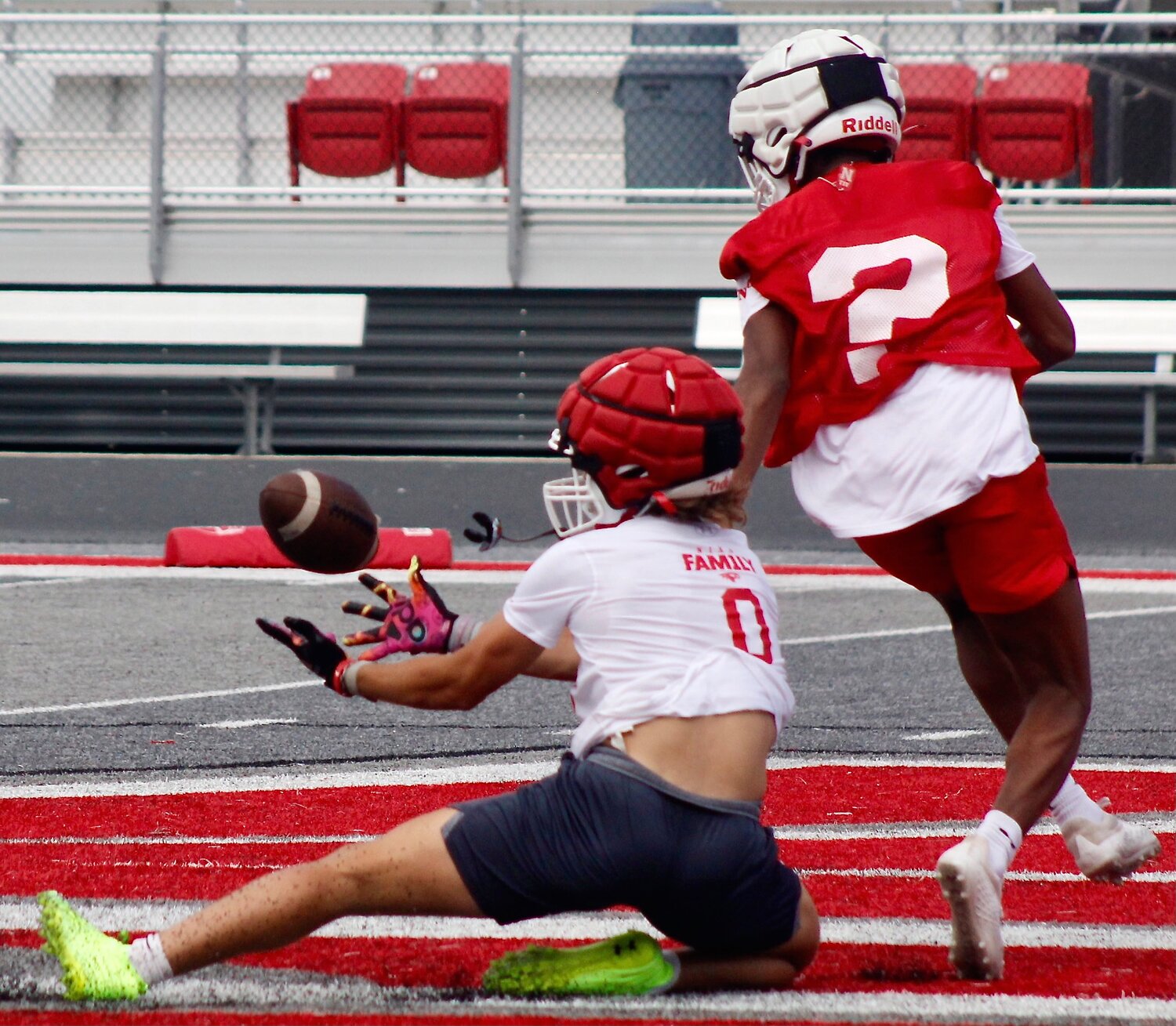 NIXA'S WYATT VINCENT hits the turf to make a catch during the Eagles' practice Tuesday.