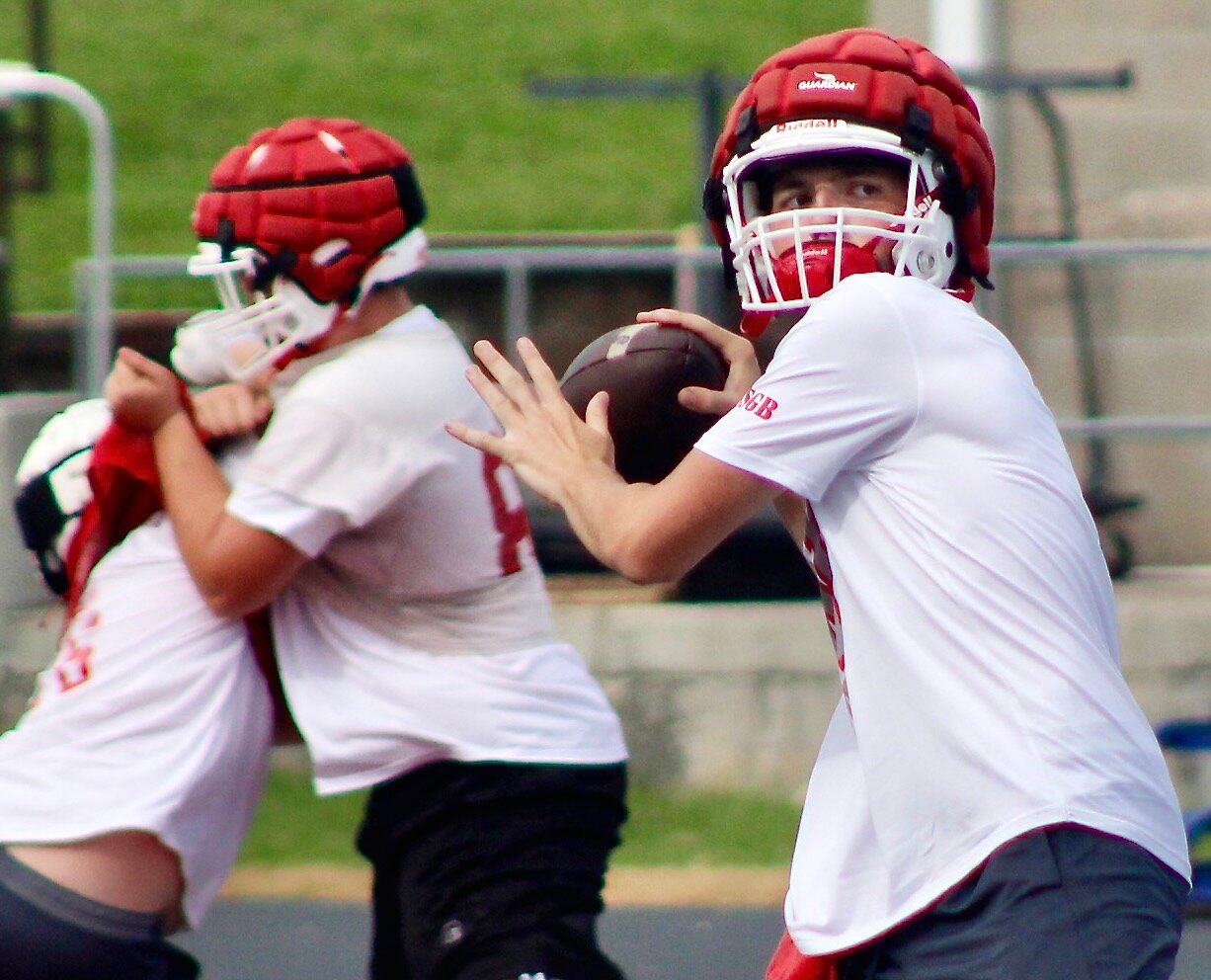 NIXA'S NATE UBER takes a loot at receivers downfield.