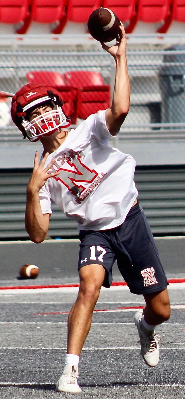NIXA'S DREW BLEVINS steps toward his target on a pass.