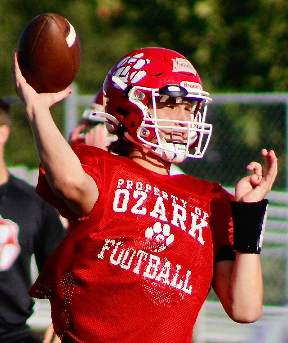 OZARK'S PEYTON RUSSELL gets set to fire a pass.