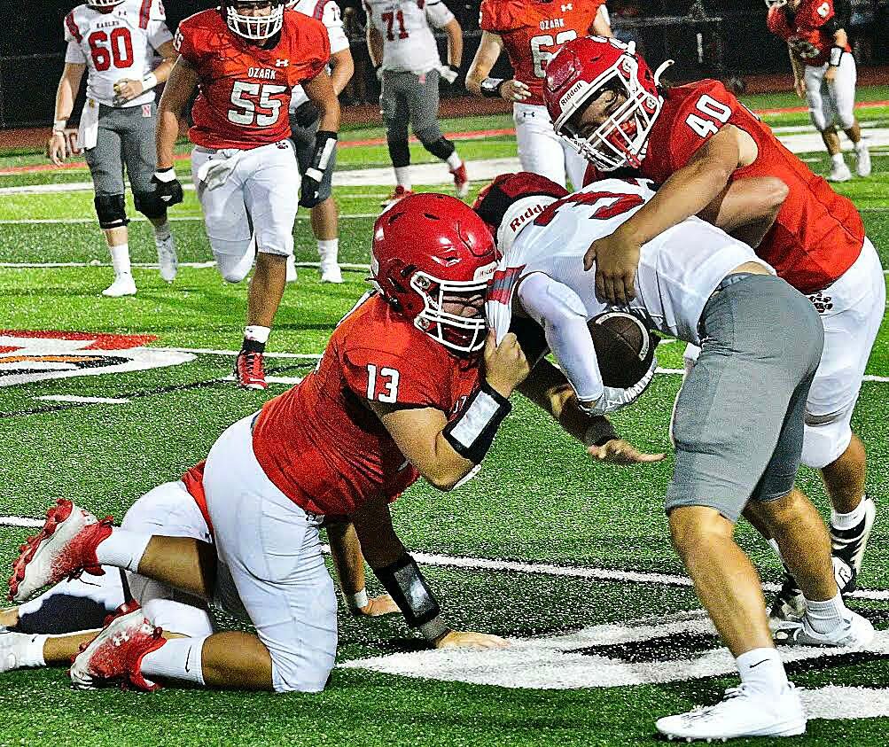 OZARK'S JOSEPH SALAZAR AND COLE ELFORD team up for a tackle.