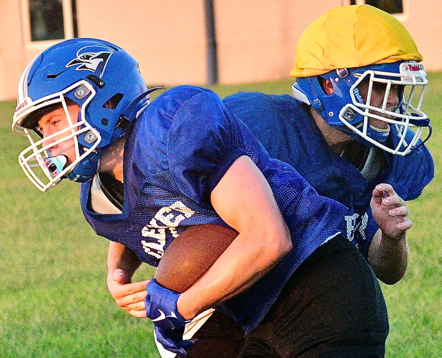 CLEVER'S LUCAS PEEBLES holds onto the ball while met by Brady Donaldson.