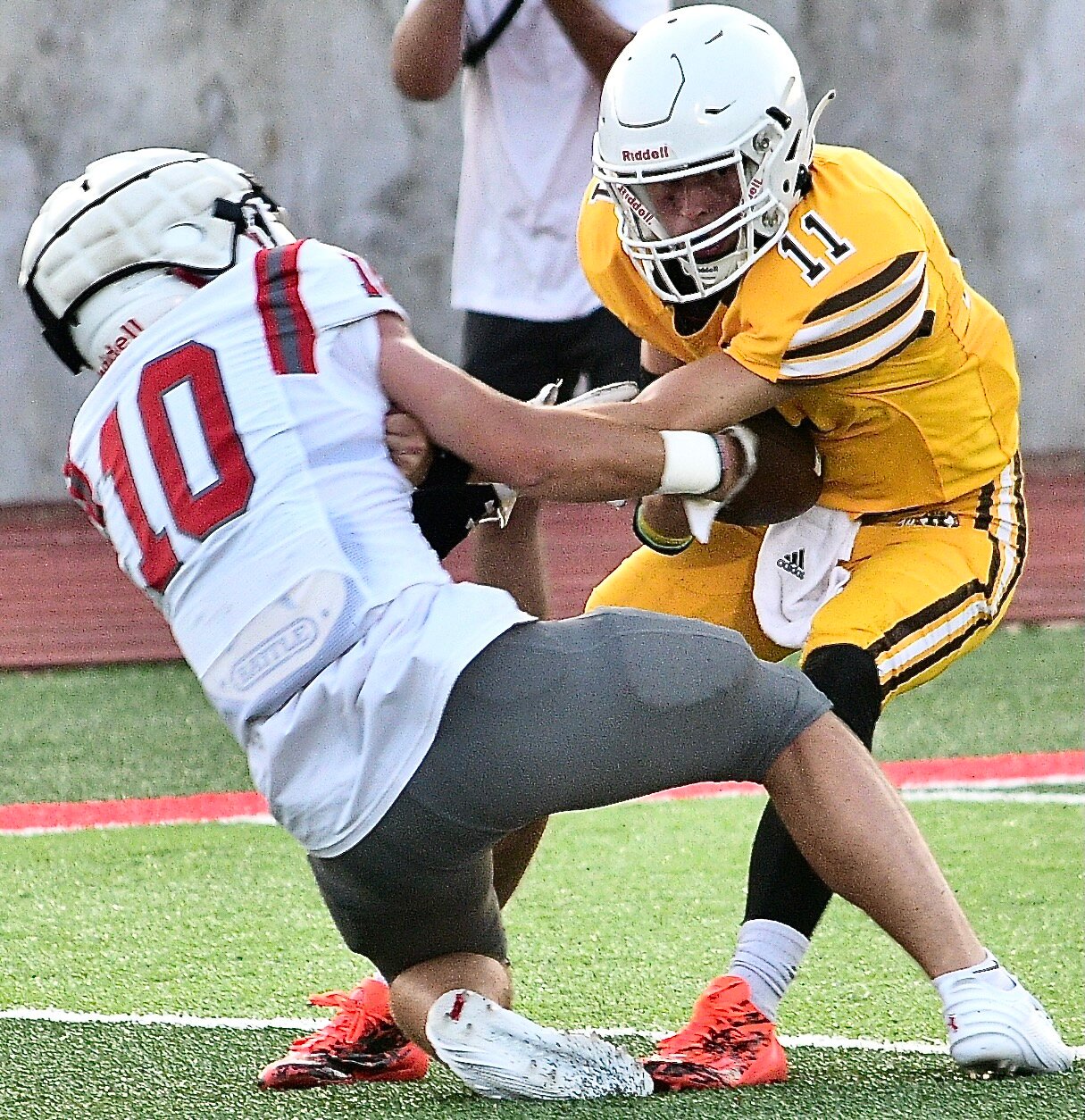 NIXA'S BRODEN MABE tries to strip the ball from a Kickapoo player's hands.