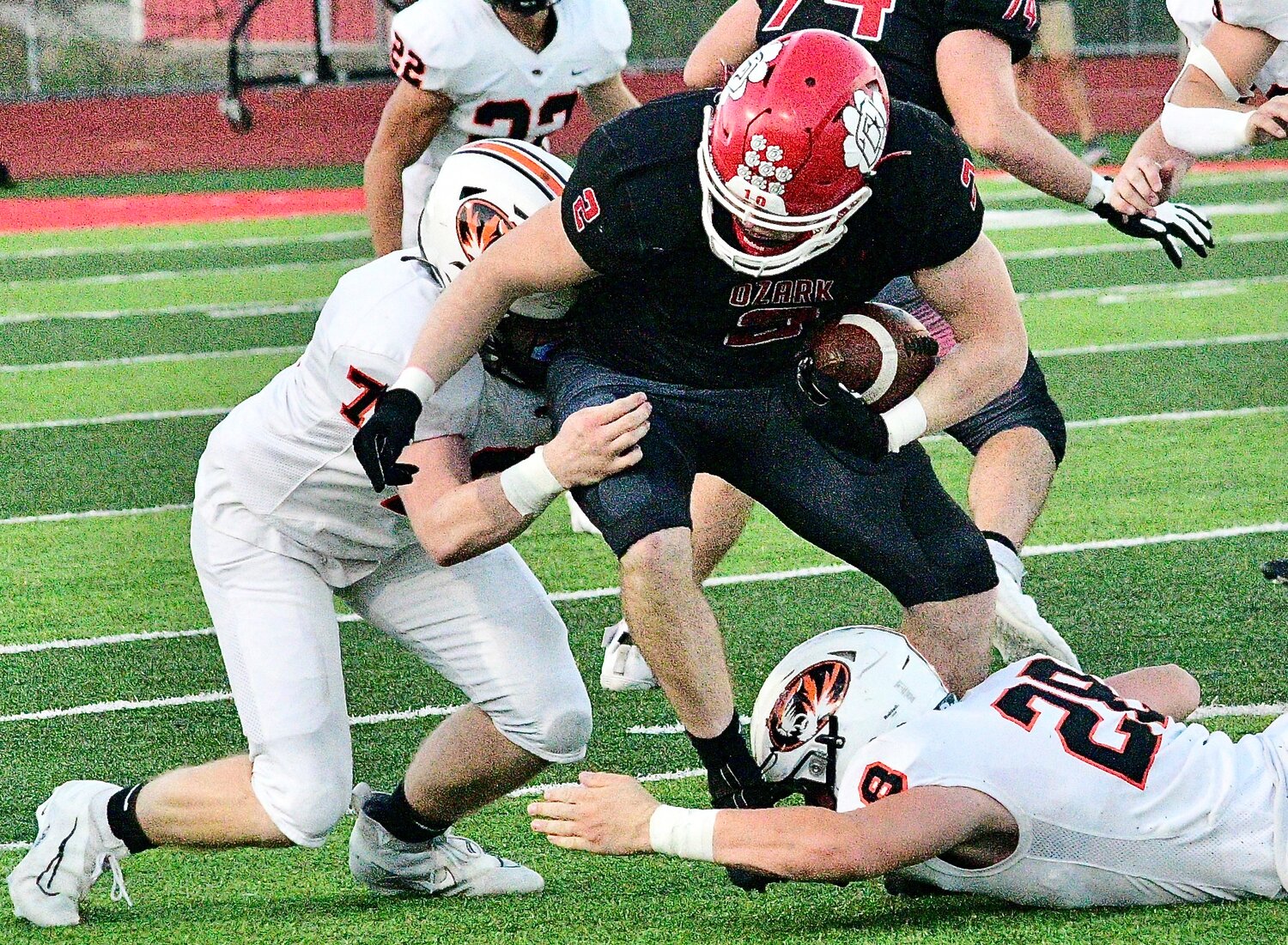 OZARK'S JACK BOWERS tries to shake a couple Republic defenders.