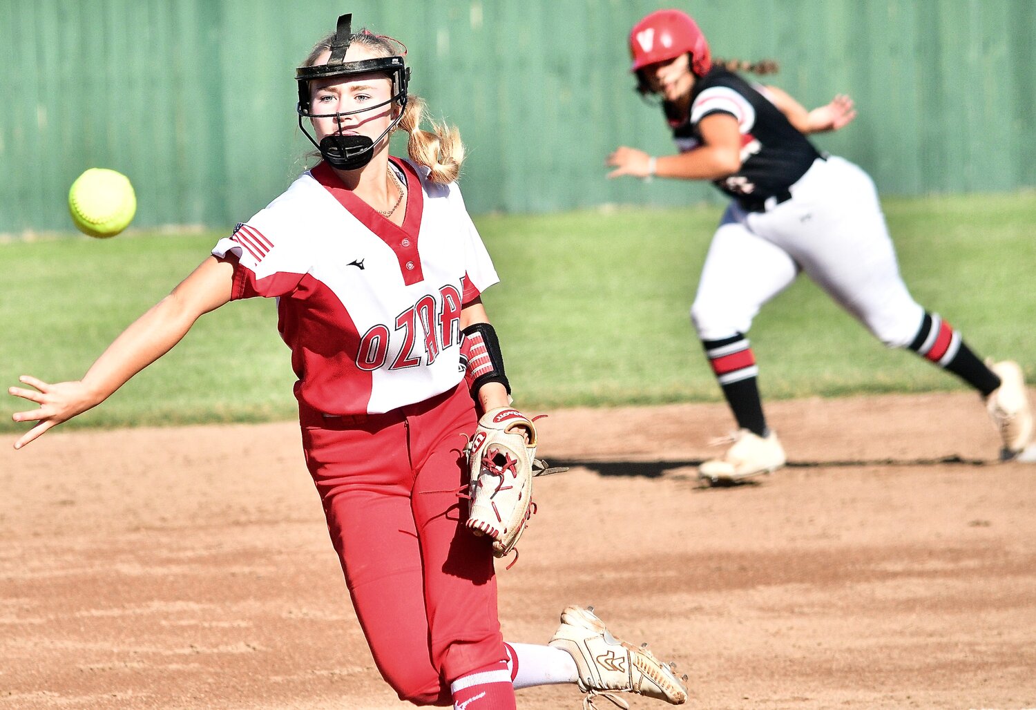 OZARK'S KENDALL MCCOY follows through on a delivery to the plate.