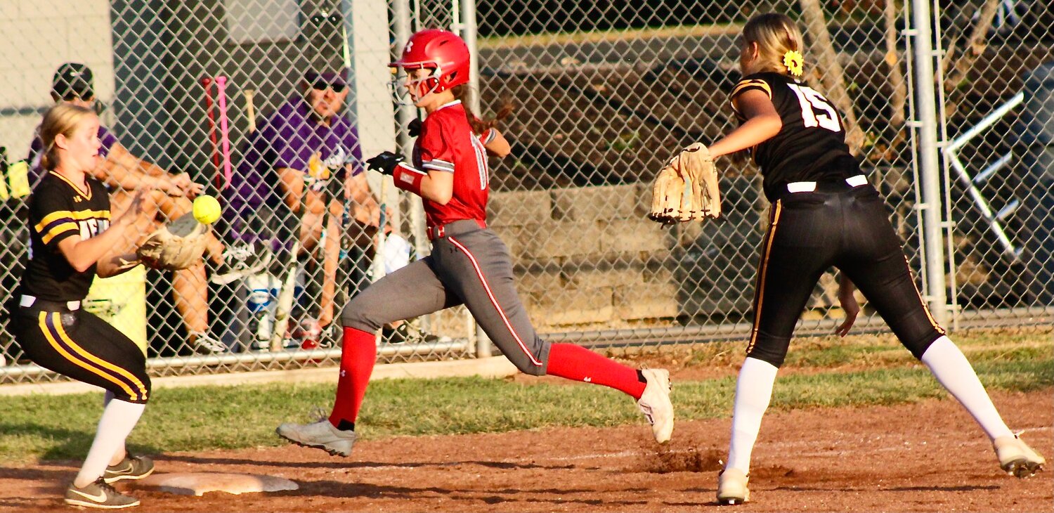NIXA'S NATALIA PHARRIS beats out a ground ball to first base for a base hit.