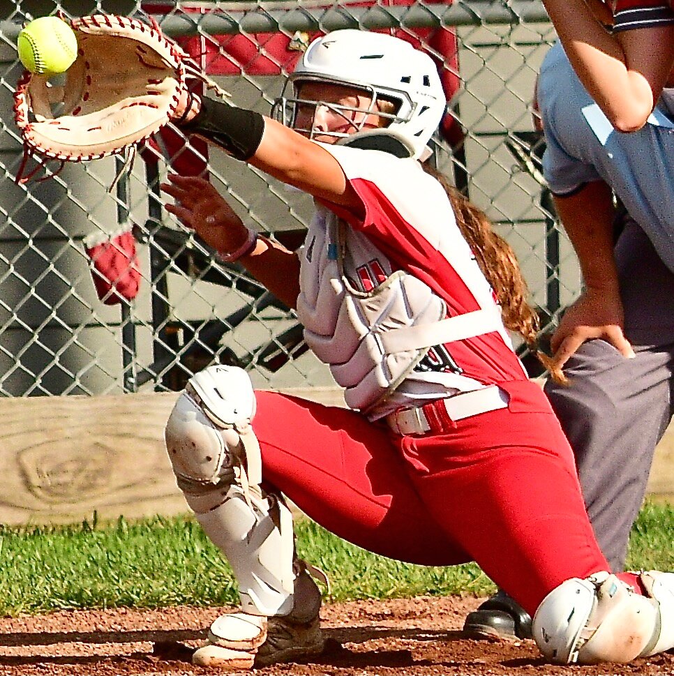 OZARK'S NATALIE MORGAN reaches for an outside pitch.