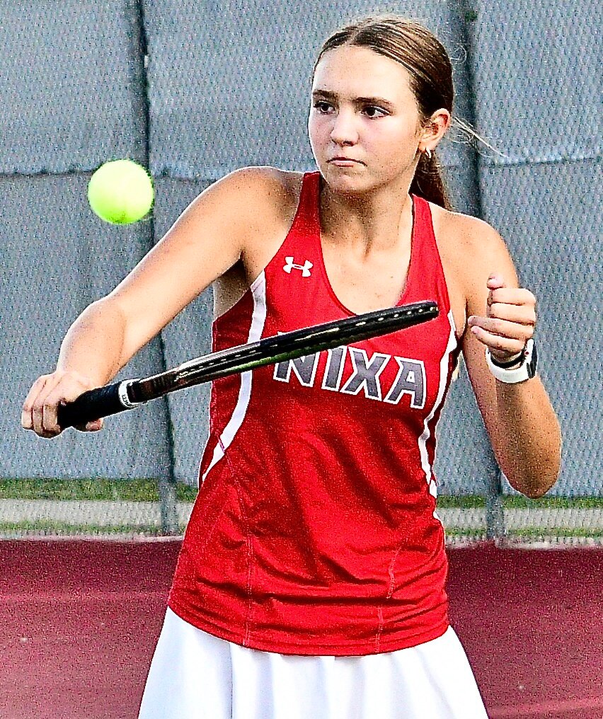 NIXA'S EMILY PETERSON applies a soft touch on a backhand return Tuesday versus Republic.