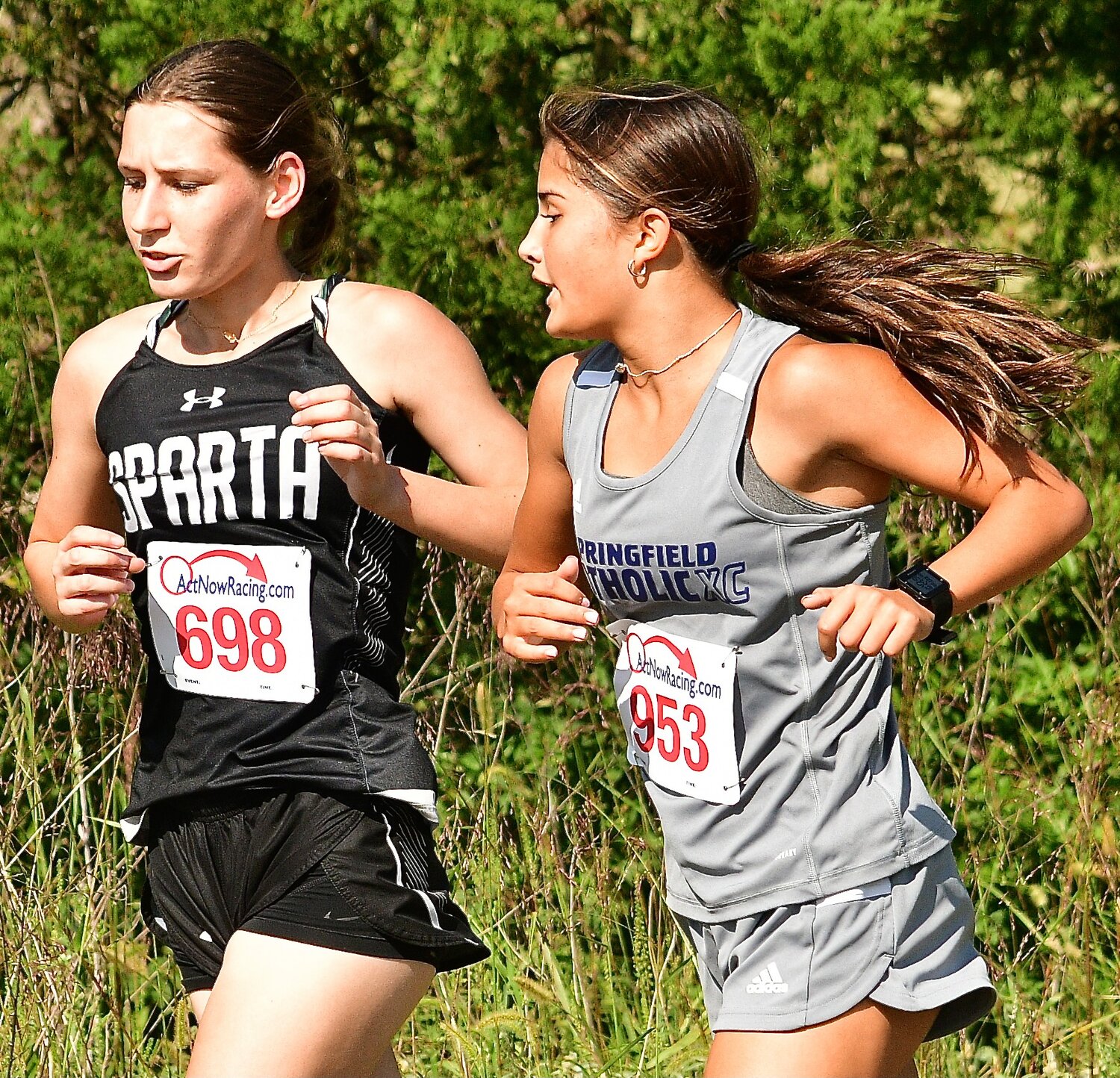 SPARTA'S ARIANNA BLEVINS runs alongside a Springfield Catholic runner.