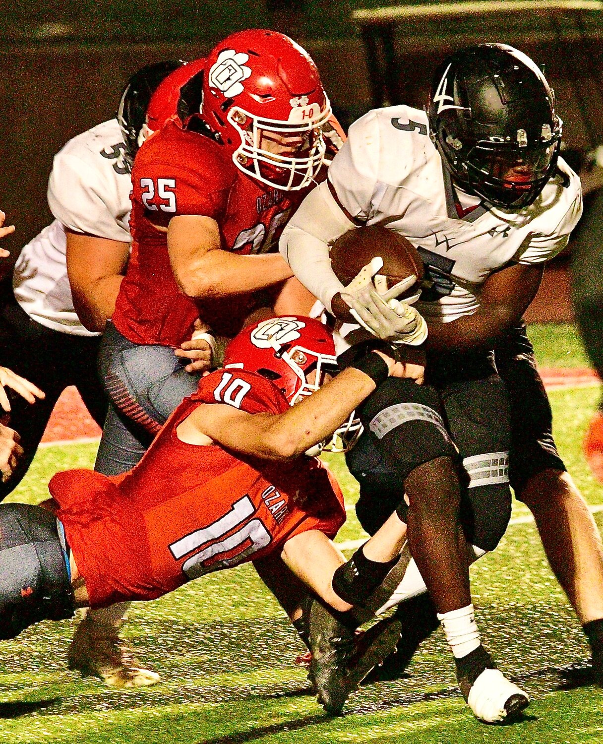 OZARK'S CHARLES LAWSON AND TAYGEN SCOTT records a tackle.