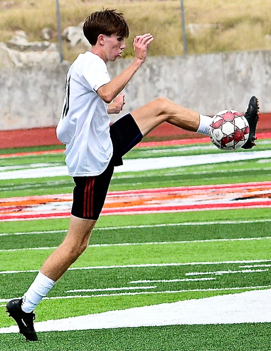 OZARK'S PHIN SCOTT gains control of the ball.