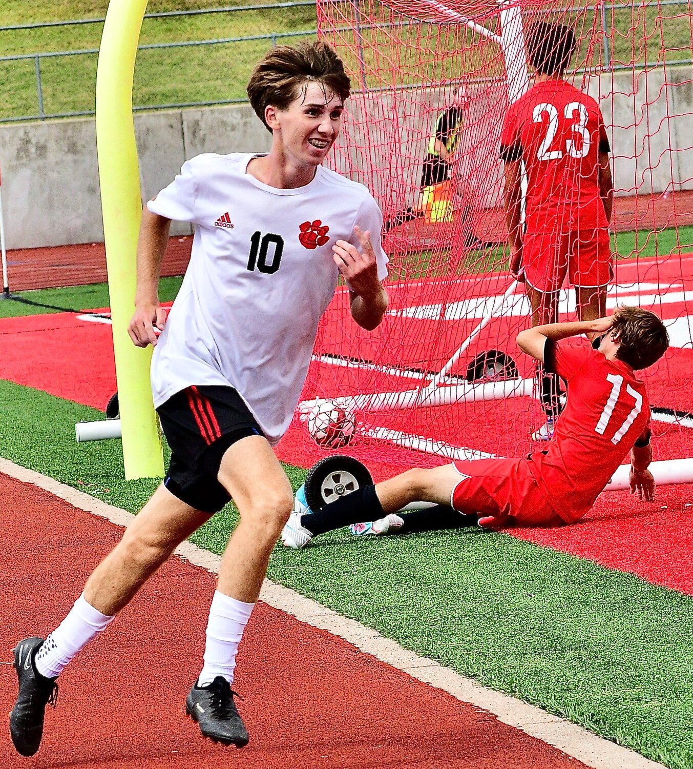 OZARK'S PHIN SCOTT is all smiles after netting a goal.