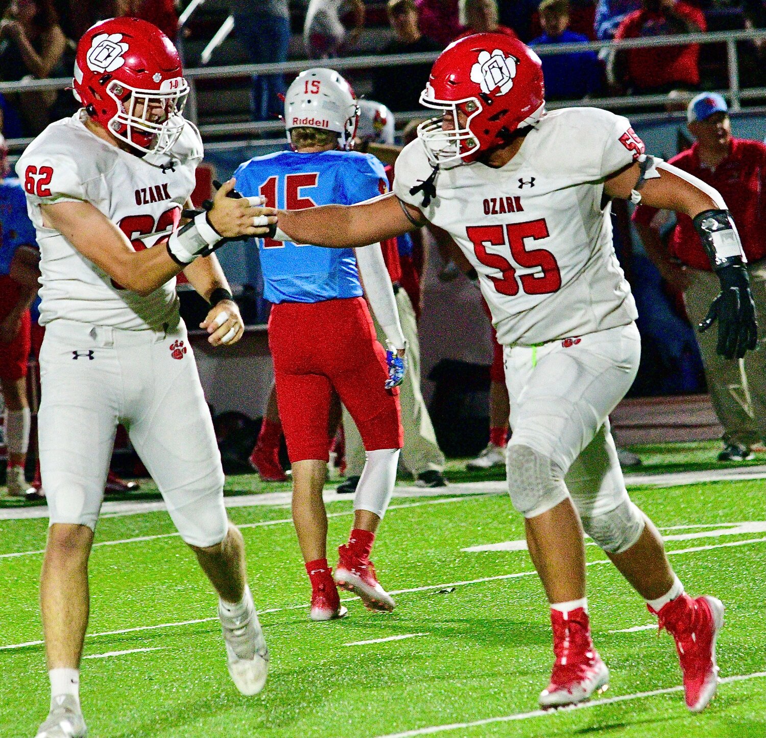 OZARK'S TYLER CYRIER AND QUENTIN COMBS celebrate a fumble recovery.