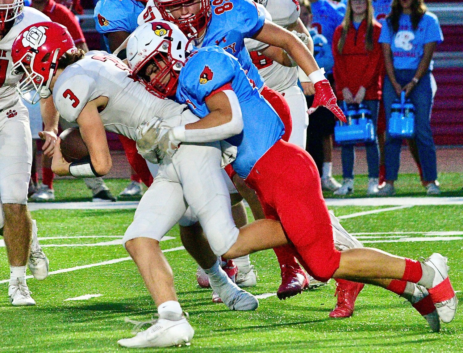 OZARK'S PEYTON RUSSELL can't elude a Webb City defender.