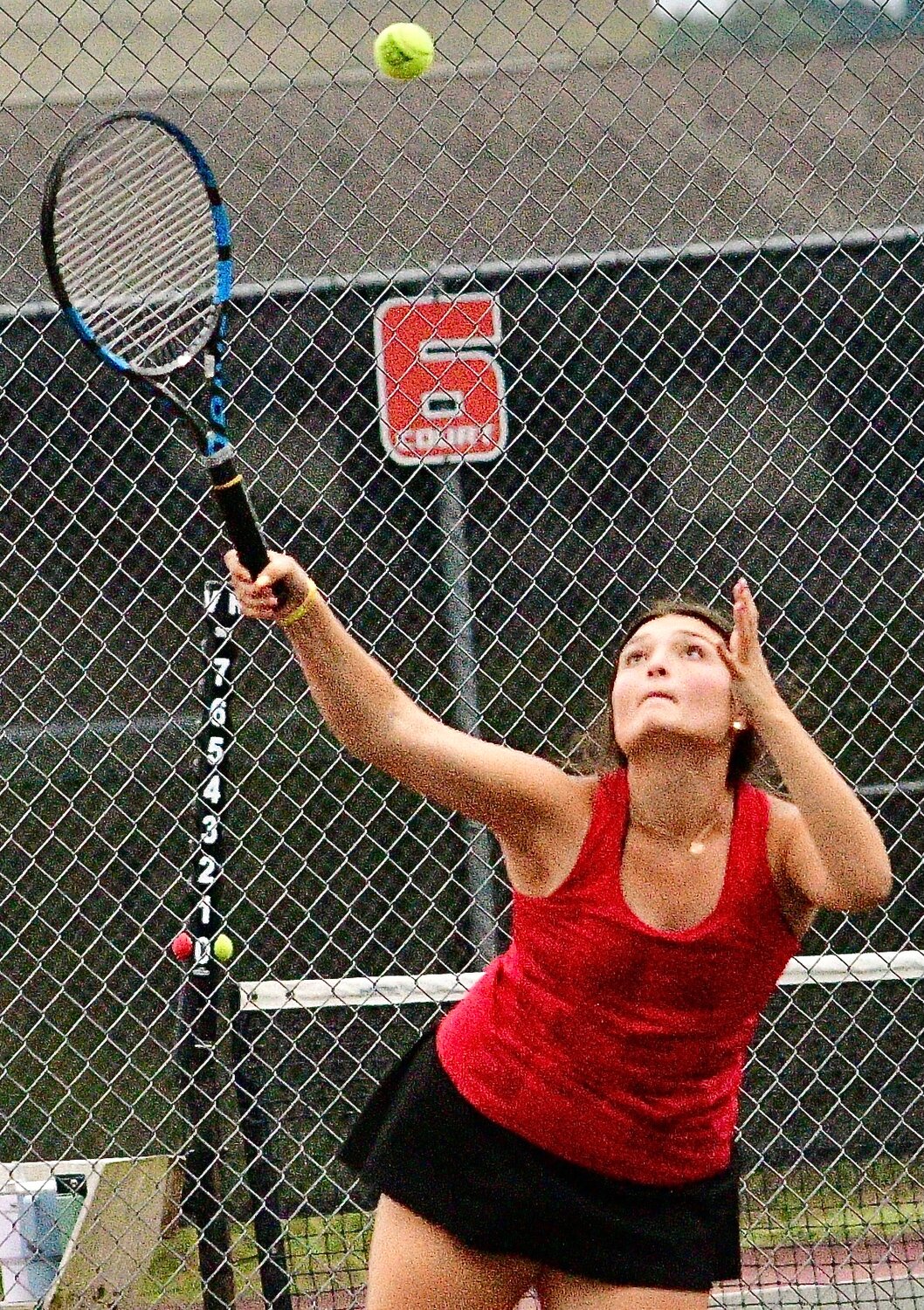 OZARK'S SERENA BROUSSARD reaches for a forehand return.