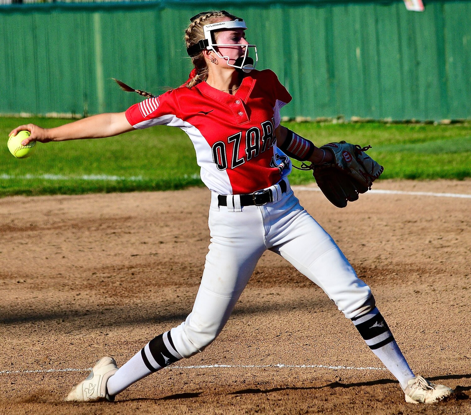 OZARK'S KENDALL MCCOY rears back to deliver a pitch home.