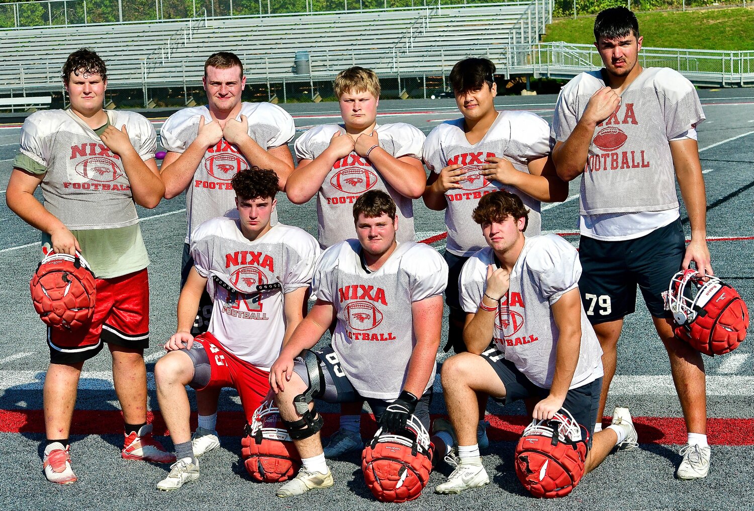 NIXA OFFENSIVE LINEMAN include (front row, l-r) Lane Meltabarger, Peyton Ewing, Clayton Pruitt, (back row, l-r) TJ Eckert, Jacob Lile, Oakly White, Ethan Cho and Jackson Cantwell.