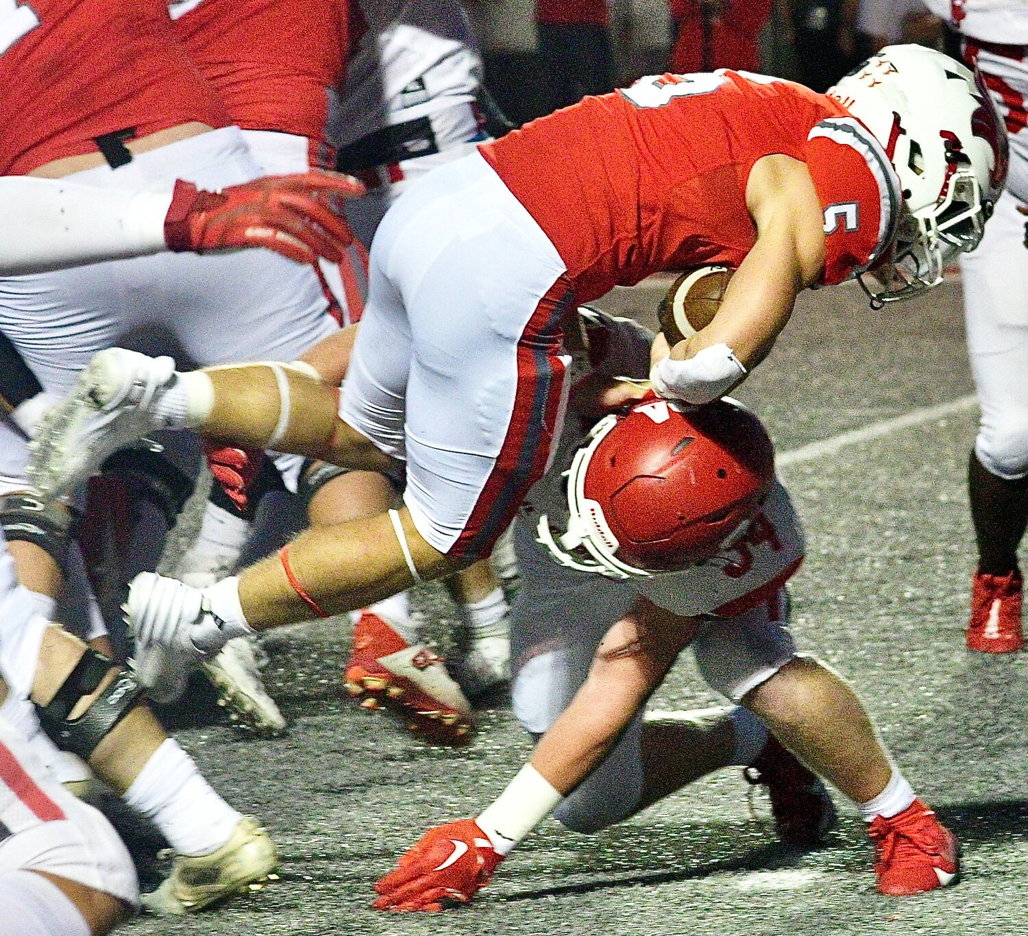 NIXA'S DYLAN REBURA holds onto the pigskin as he is upended.