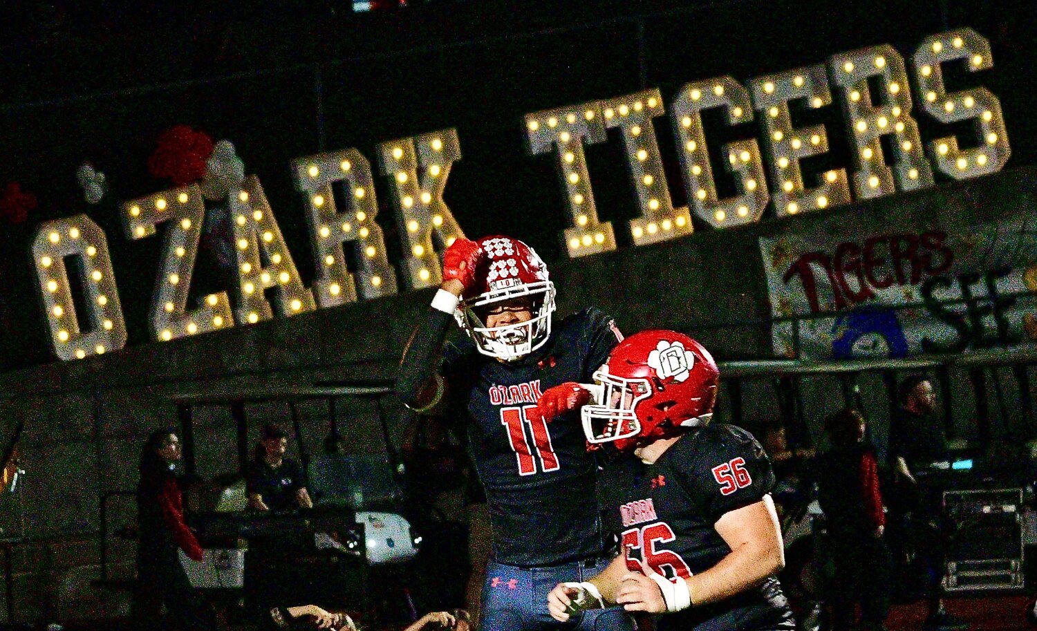 OZARK'S SAM CLARK AND COLIN COOK celebrate a Clark touchdown catch on Homecoming night versus Carthage on Friday.
