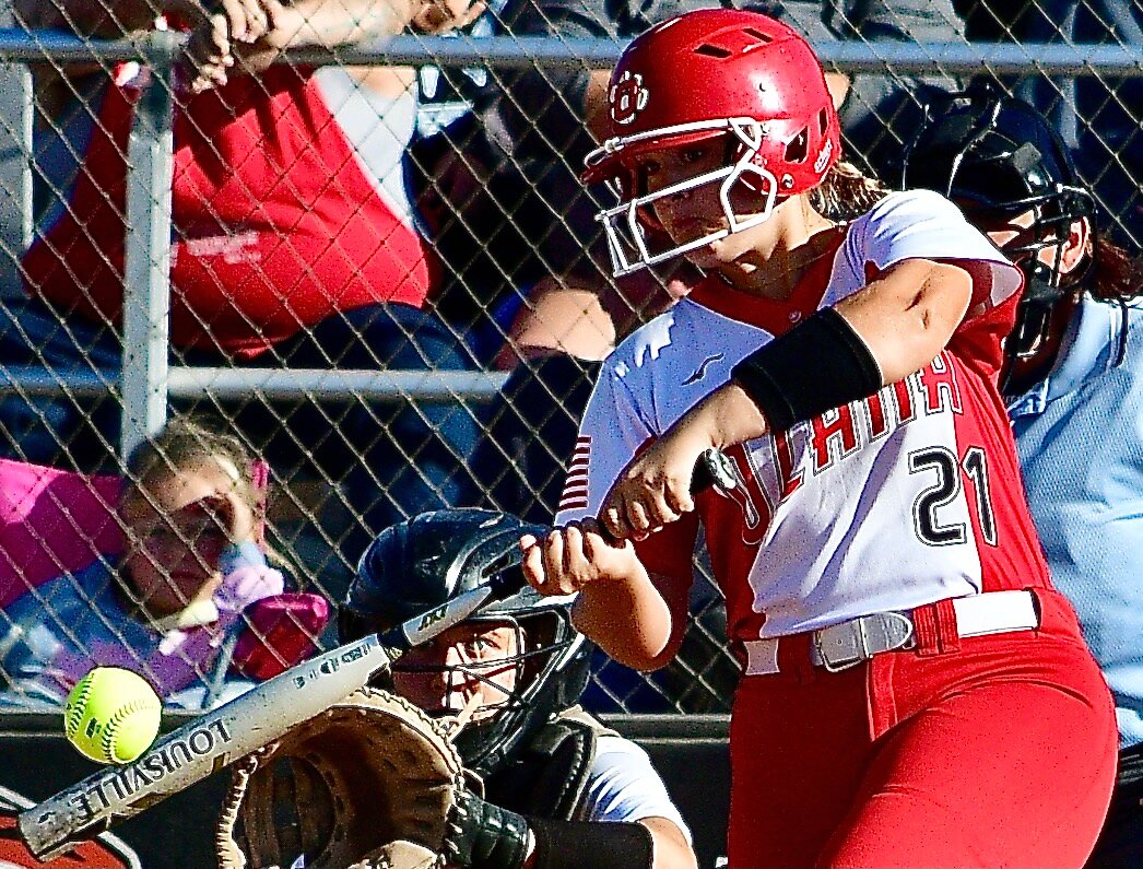 OZARK'S EMILY GRIEST connects for an RBI-double.