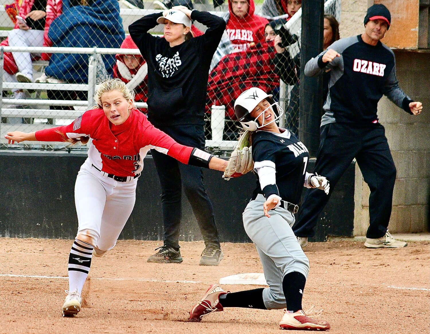 OZARK'S KELSIE BATEY tags out a Willard runner in front of third base in the teams' Class 5 District 5 semifinal Saturday.