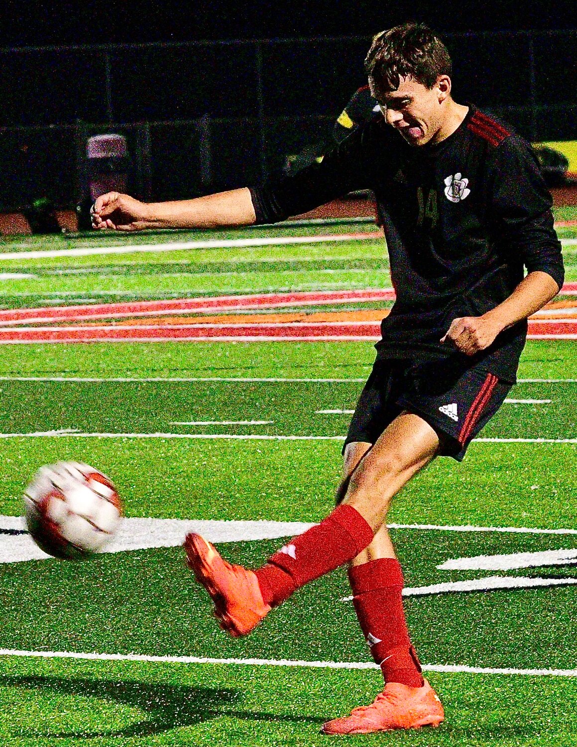 OZARK'S JAKE GARNER boots the ball to a teammate.