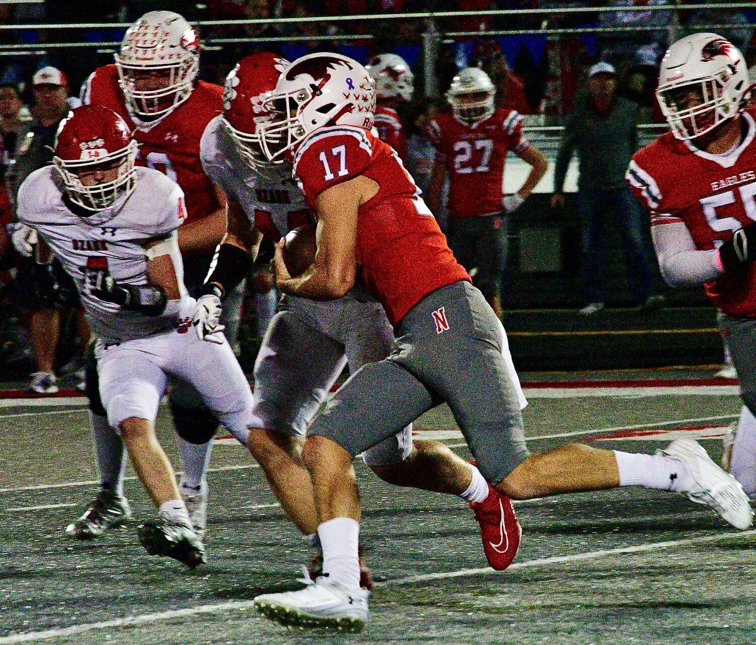 NIXA'S DREW BLEVINS runs out of the pocket.