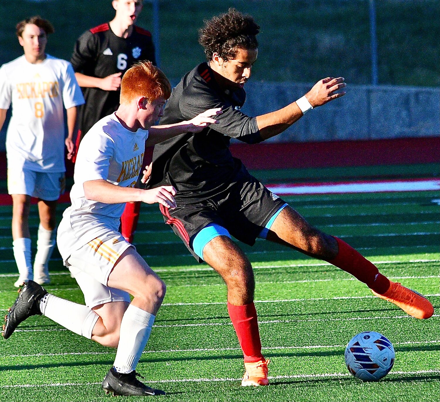 OZARK'S ALEX WILLIAMS keeps himself between the ball and a defender.