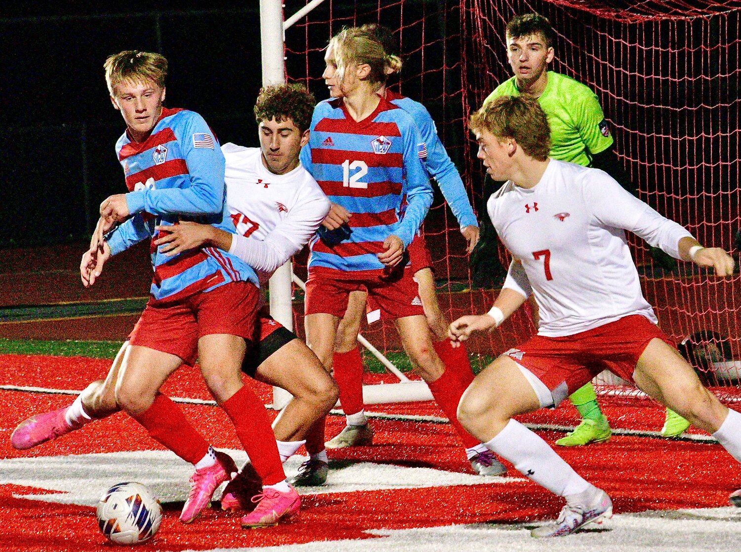 NIXA'S JAYDEN TATE tries to find room around a Glendale player in the penalty box Thursday.