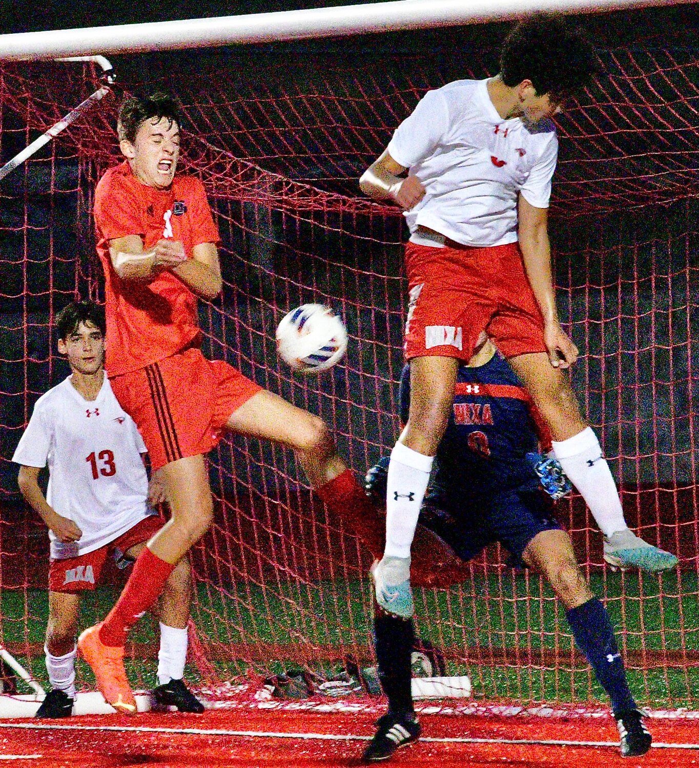 OZARK'S JAKE GARNER receive a pass in front of the Tigers' goal.