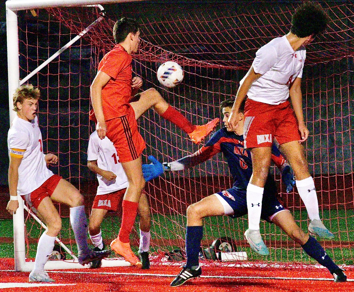 OZARK'S JAKE GARNER lift his left leg up above his waist to record a goal.