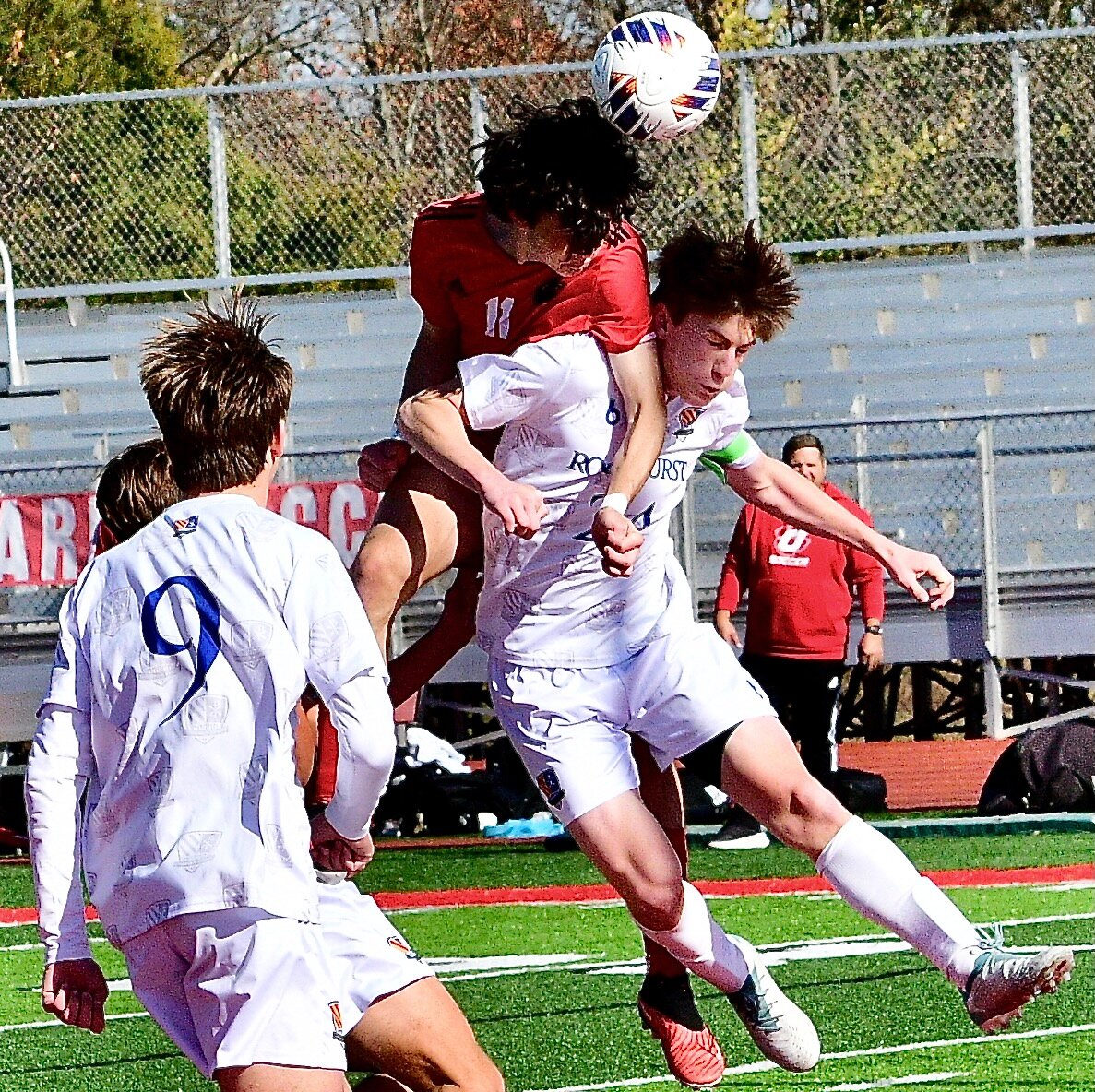 OZARK'S CALEB LEPANT battles for position to attack with a header.