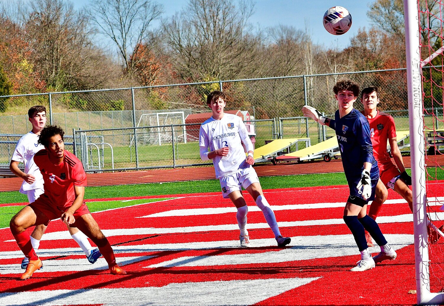 OZARK'S ALEX WILLIAMS watches as his shot attempt hits the post of the Tigers' goal.
