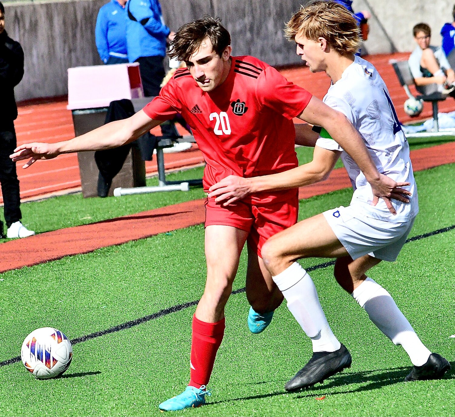 OZARK'S MICAH THRASHER keeps the ball in between himself and a Rockhurst player.