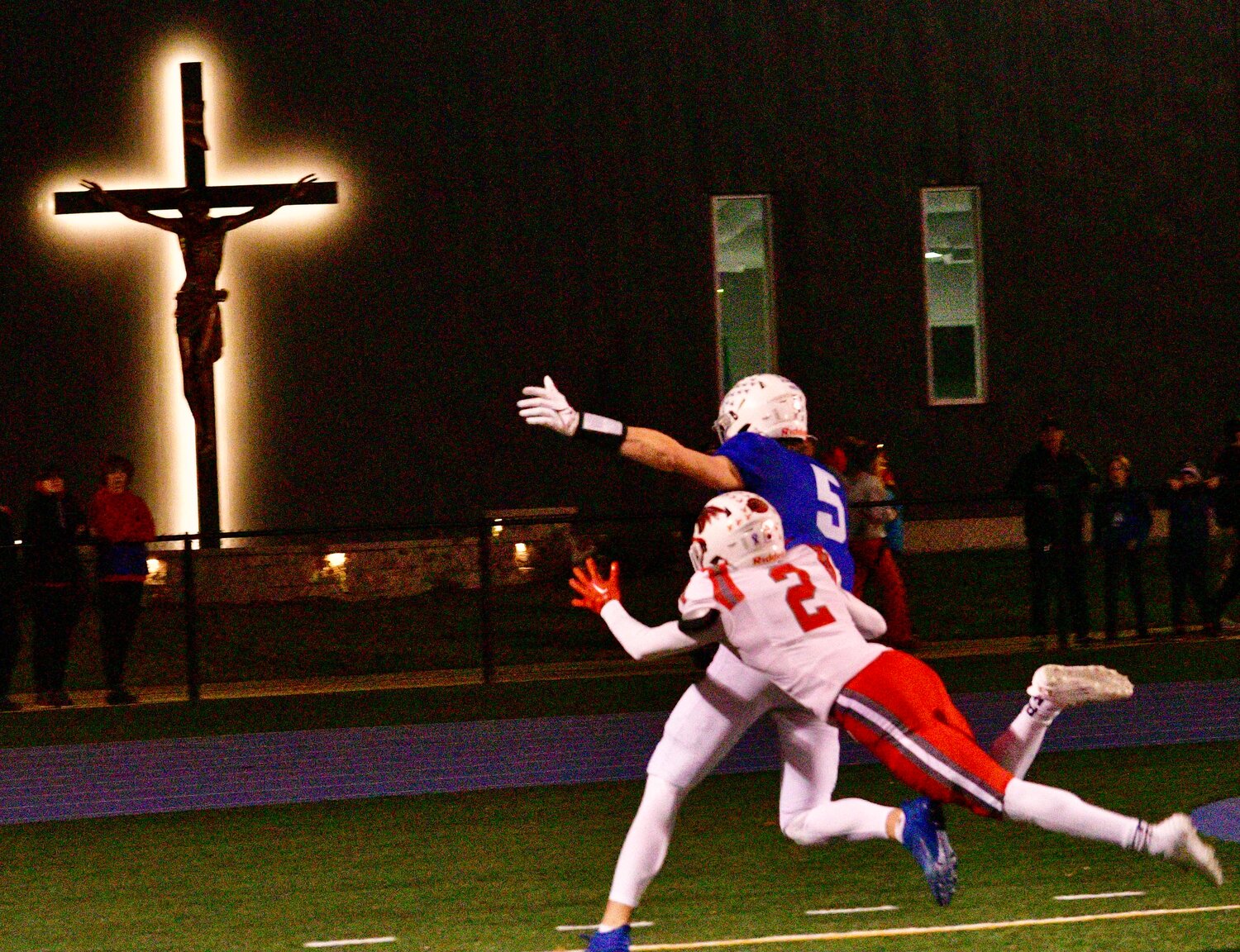 NIXA'S RANDY FLINT defends a Rockhurst pass in the end zone.