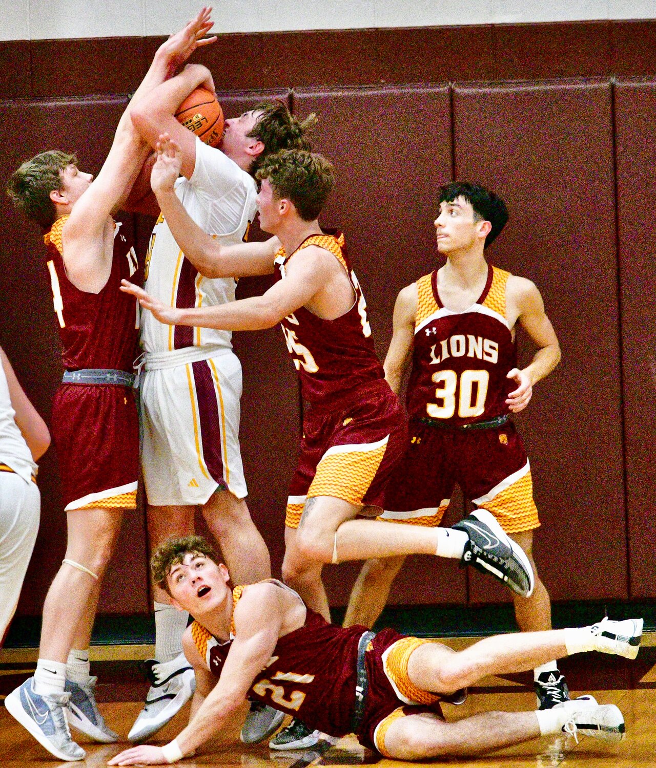 SPOKANE'S ETHAN NEWELL tries to get a shot off against Mansfield on Tuesday.
