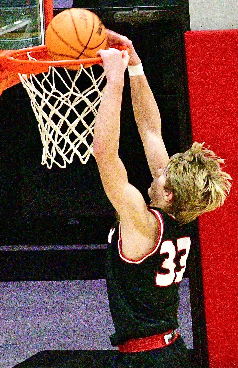 CHADWICK'S CLAYTON GARRISON dunks with two hands.
