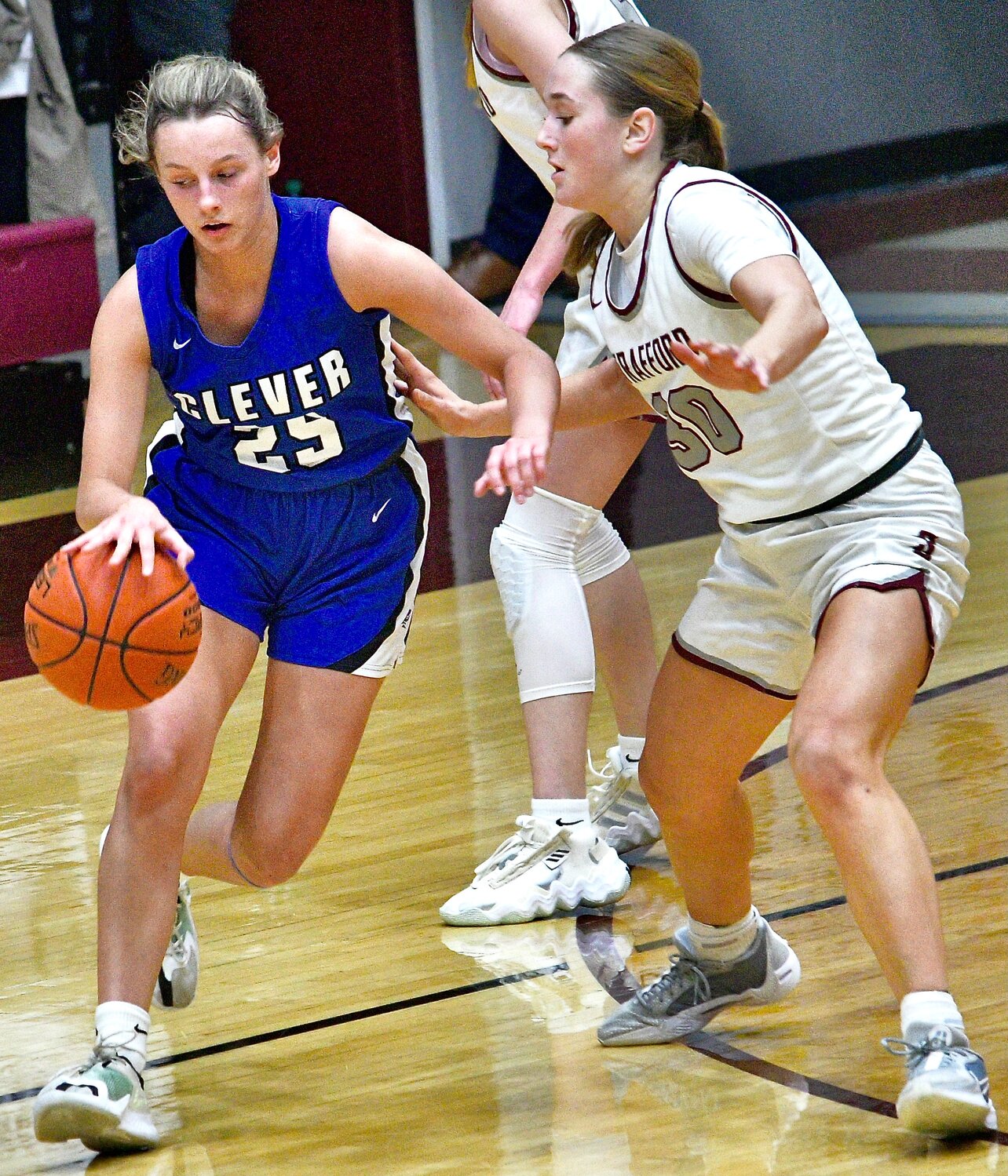 CLEVER'S MACKENZIE CAMP looks for room around a defender.