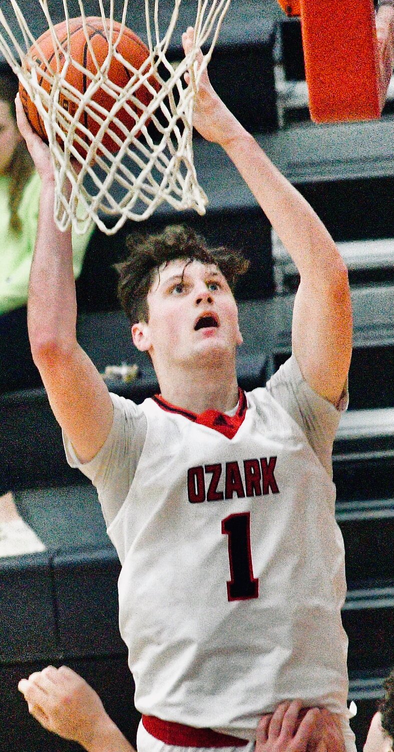 OZARK'S JACE WHATLEY shoot for two of his 20 points against Carthage earlier this week.