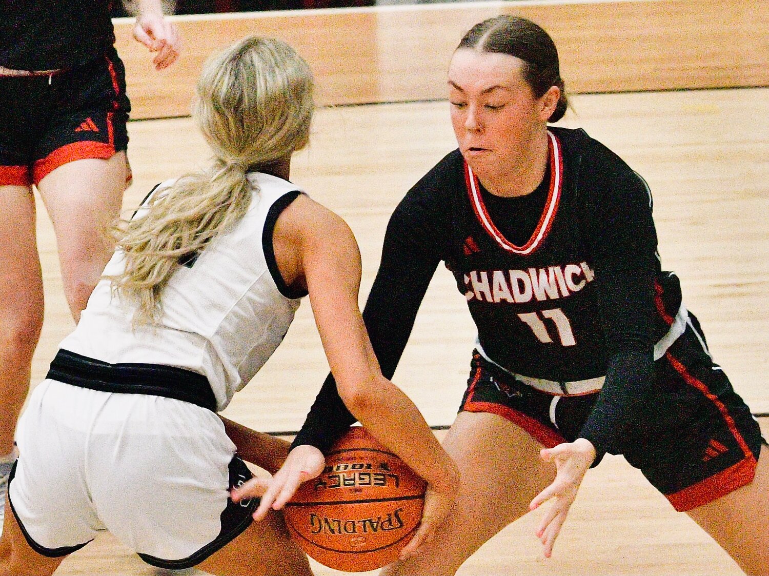 CHADWICK'S ELLA HERD forces a tie-up against Sparta's Averi Leyland.