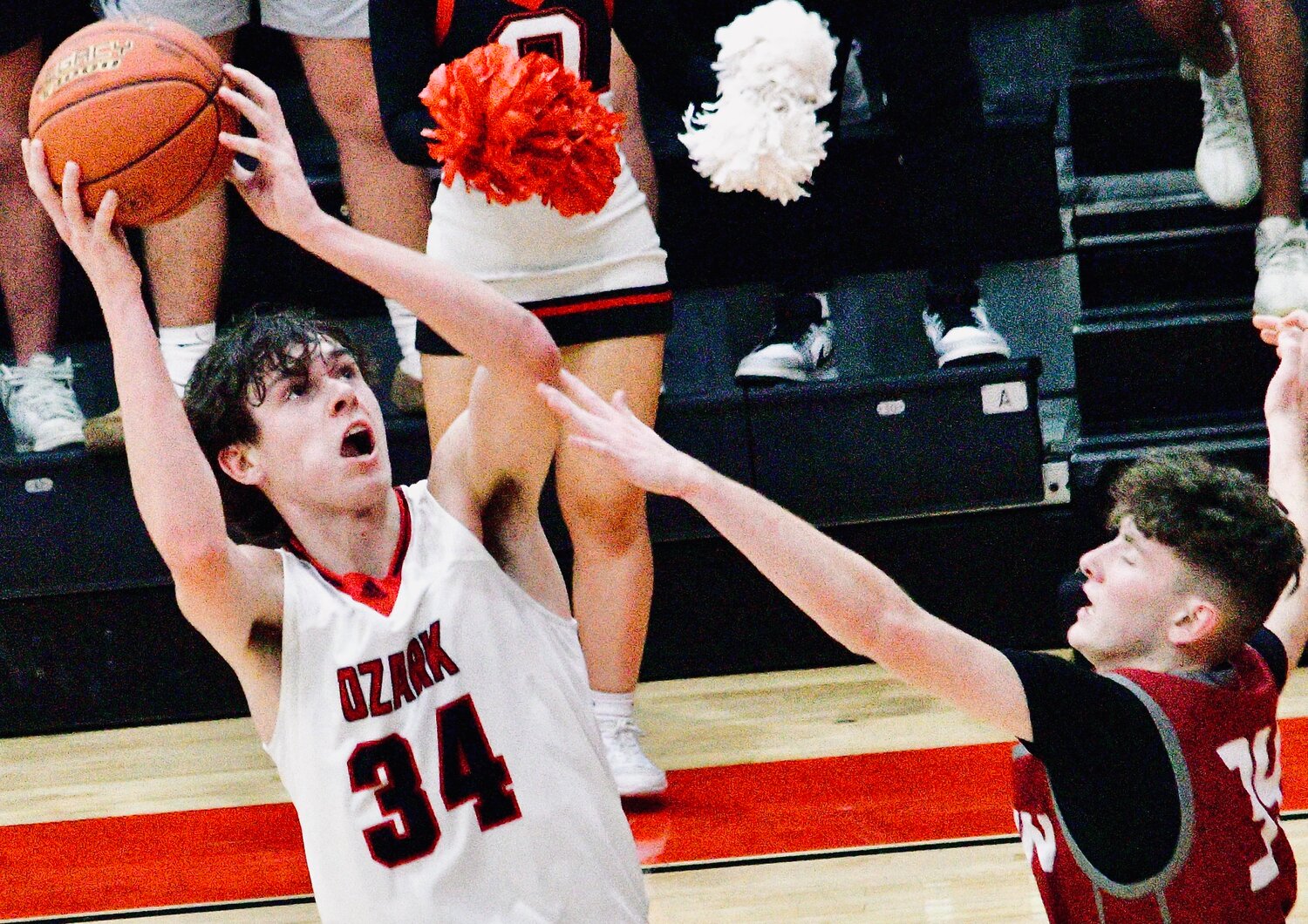 OZARK'S COHEN GEORGE looks to score in the paint.
